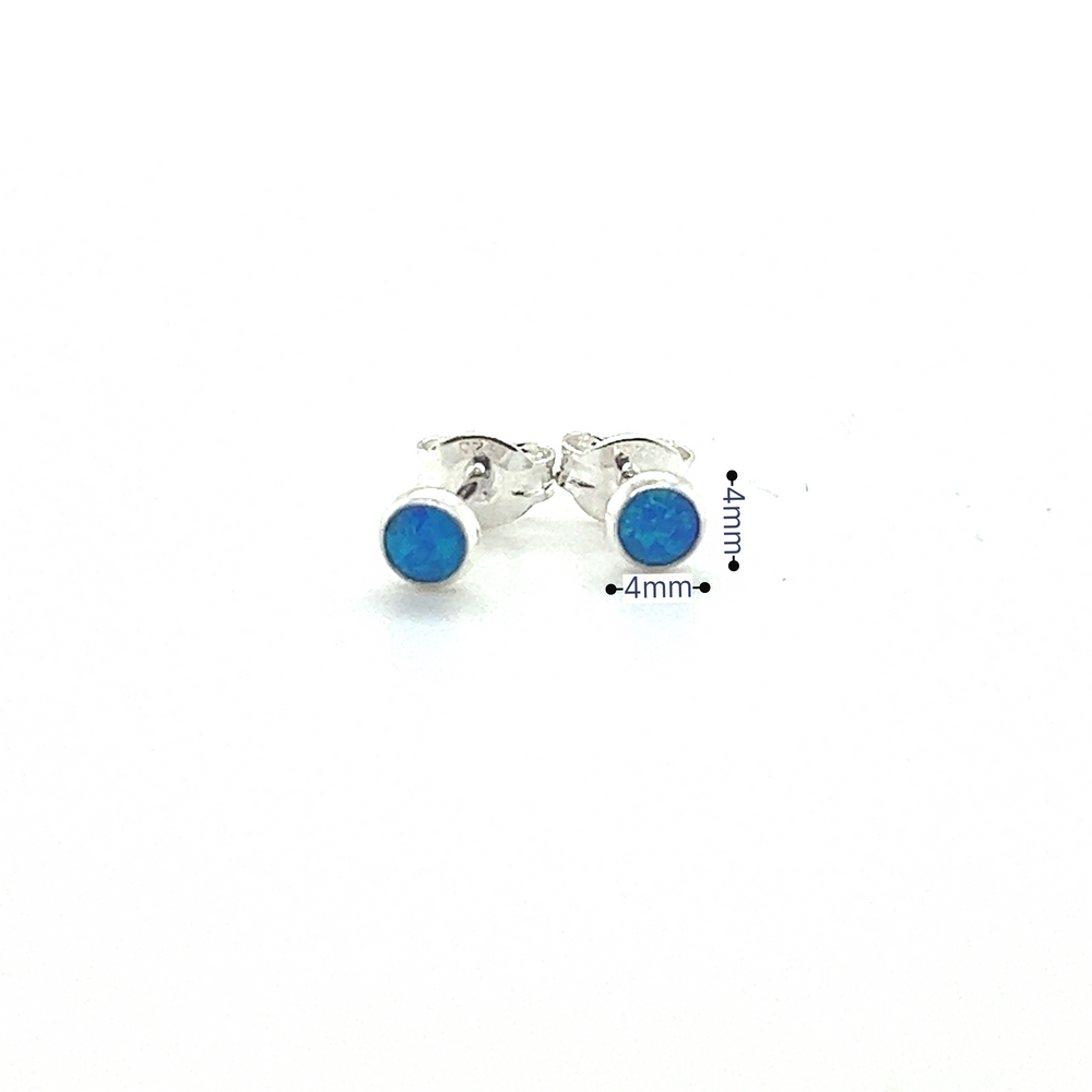 
                  
                    A pair of Super Silver Dainty Opal Studs featuring minimalist designs on a white background.
                  
                