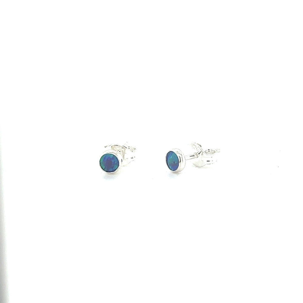 
                  
                    A pair of Super Silver Dainty Opal Studs, made with sterling silver, displayed on a white background.
                  
                