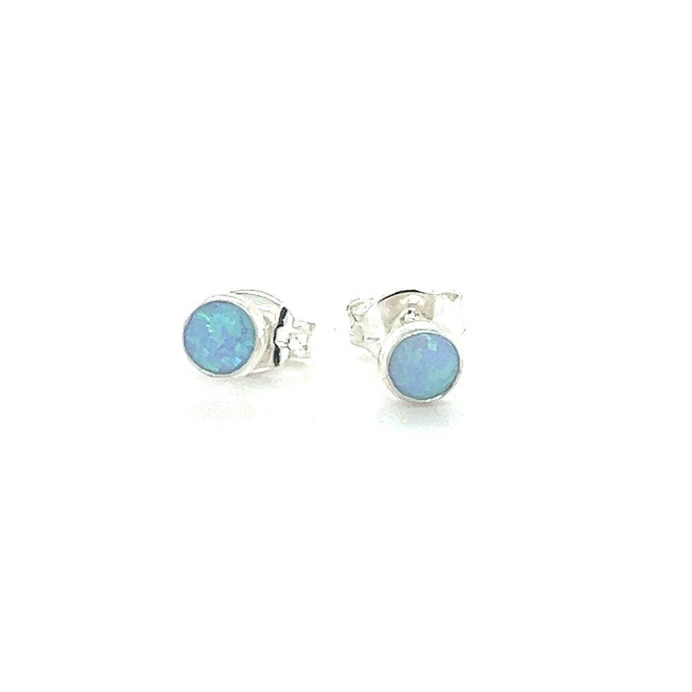 
                  
                    A pair of Super Silver Dainty Opal Studs, crafted in sterling silver, showcased on a white background.
                  
                
