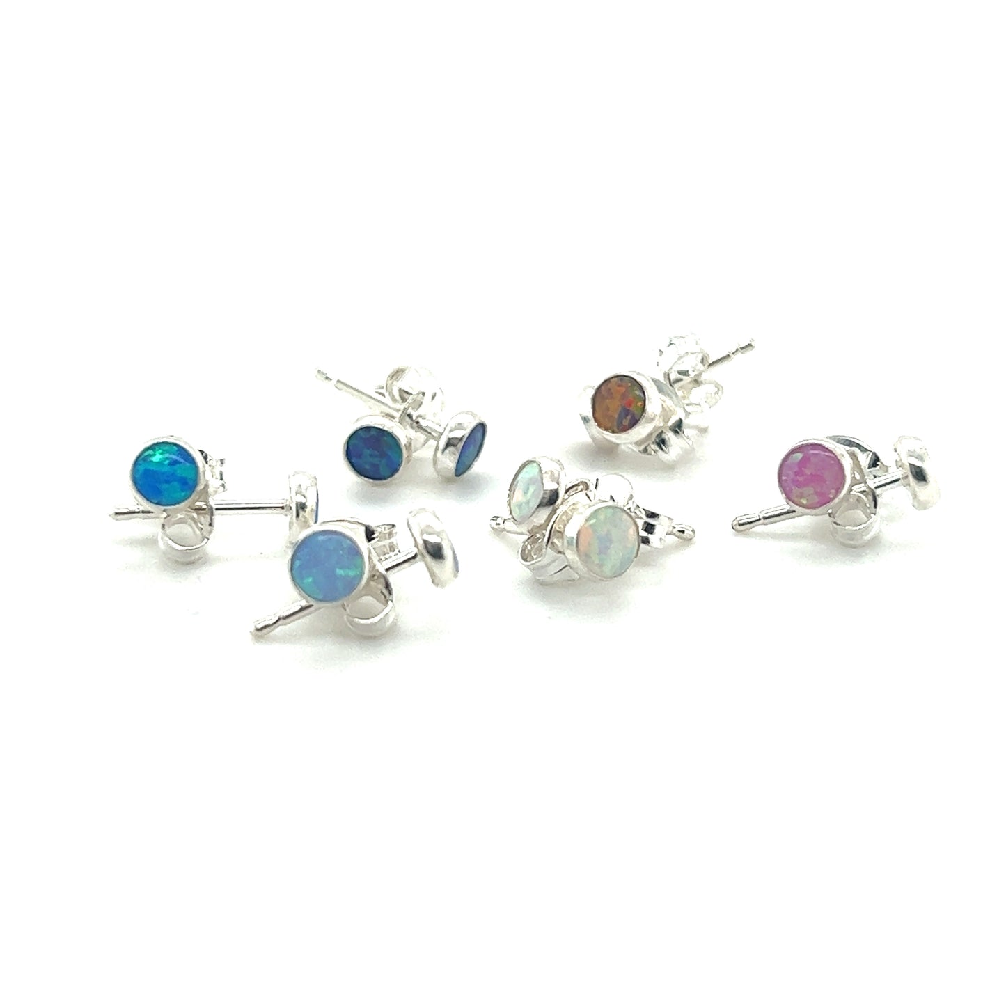 A collection of Dainty Opal Studs with minimalist designs on a white background.
