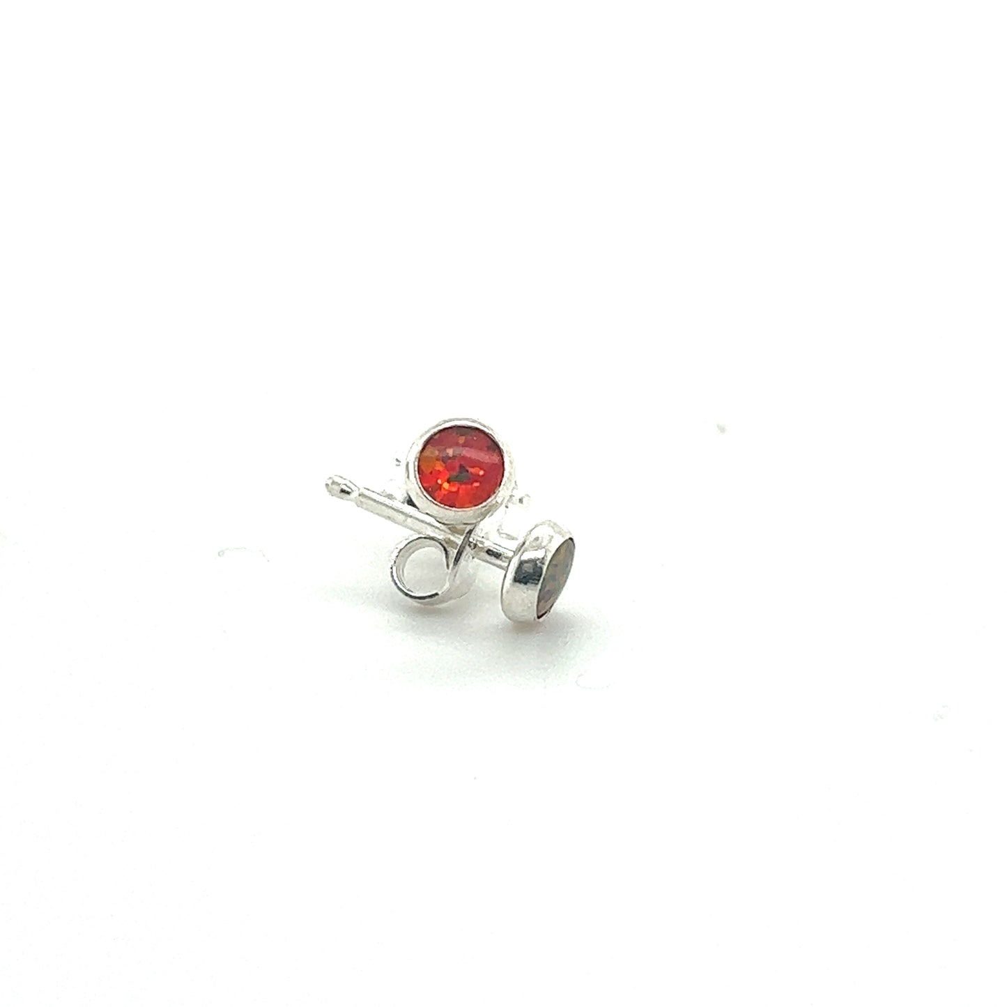 
                  
                    A pair of Dainty Opal Studs by Super Silver, with a red stone, perfect for minimalist designs.
                  
                