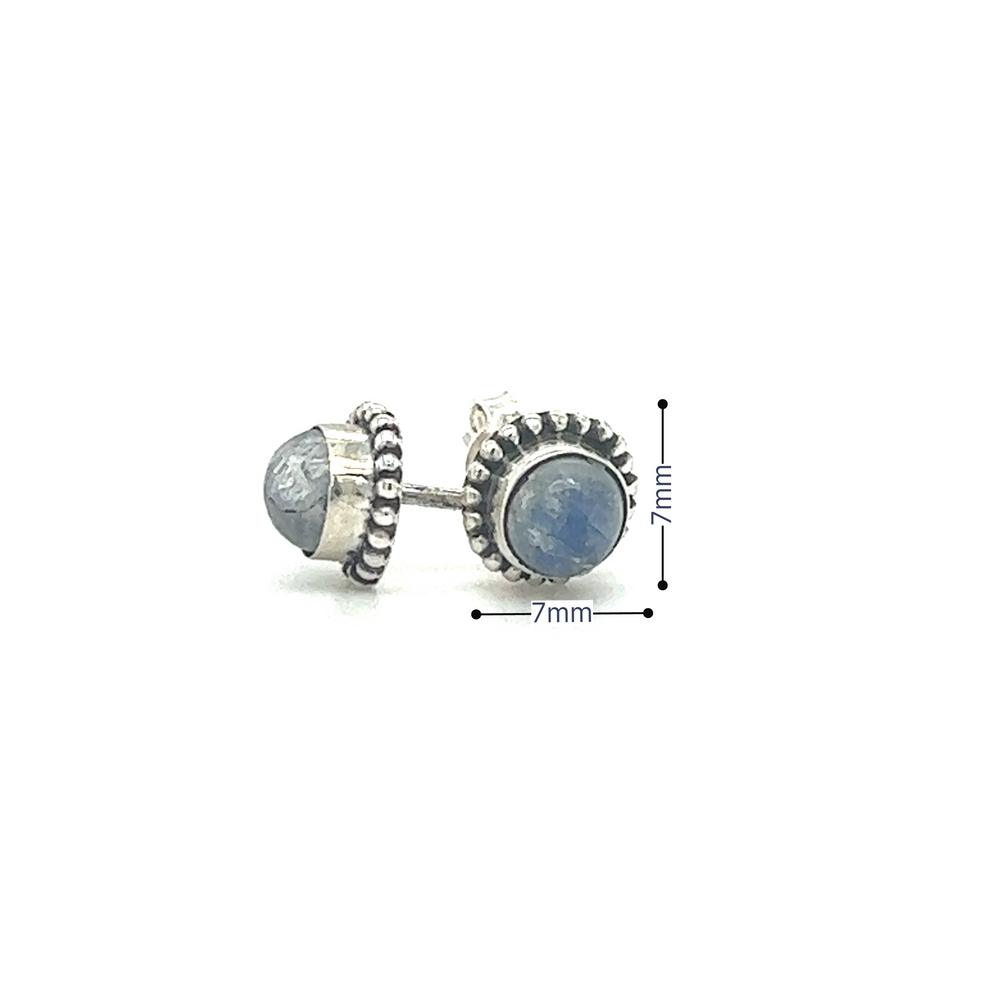 
                  
                    A pair of Chic Beaded Round Stone Studs earrings with a luminous blue stone by Super Silver.
                  
                
