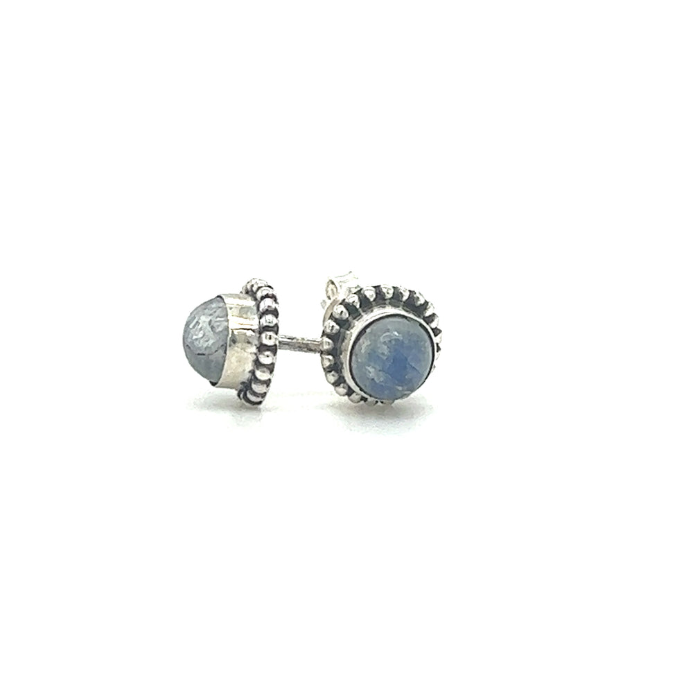 
                  
                    A pair of Chic Beaded Round Stone Studs adorned with a luminous blue Moonstone by Super Silver.
                  
                