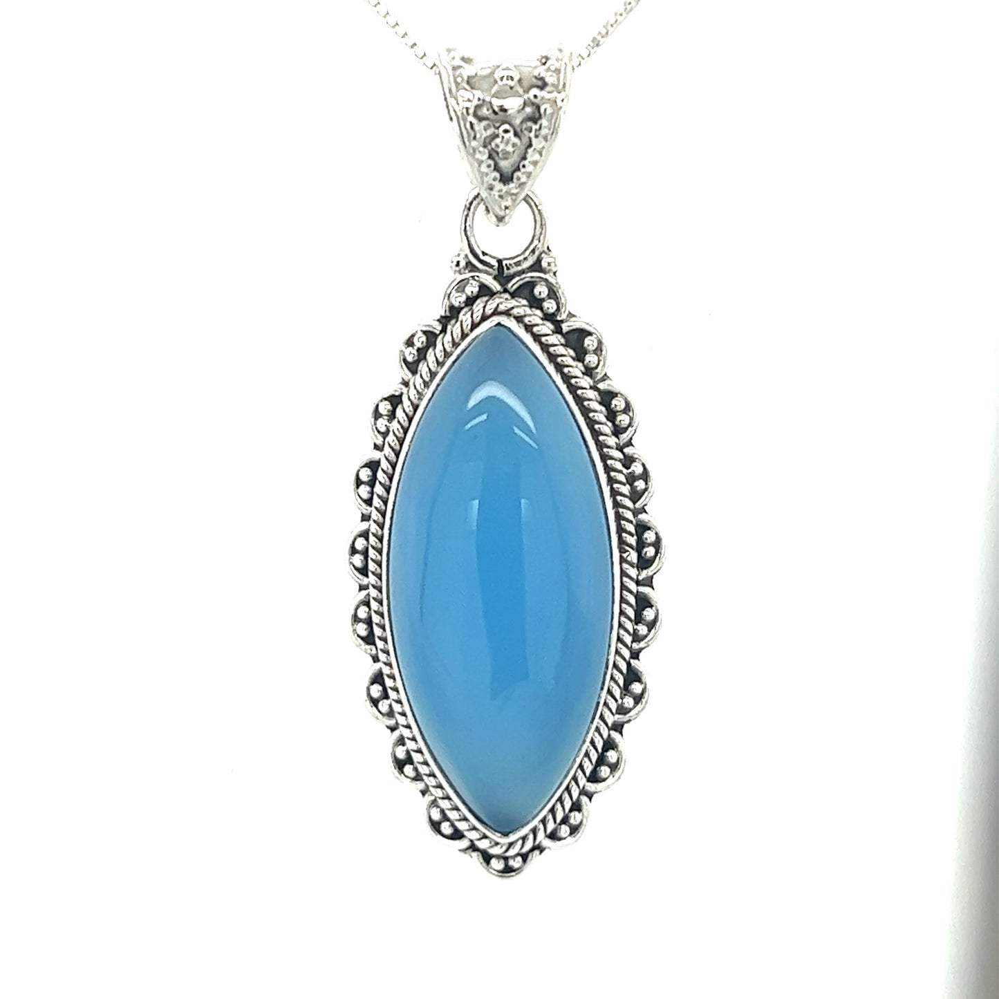 
                  
                    A Marquise Shaped Gemstone Pendant adorned with a vibrant blue chalcedony stone by Super Silver.
                  
                