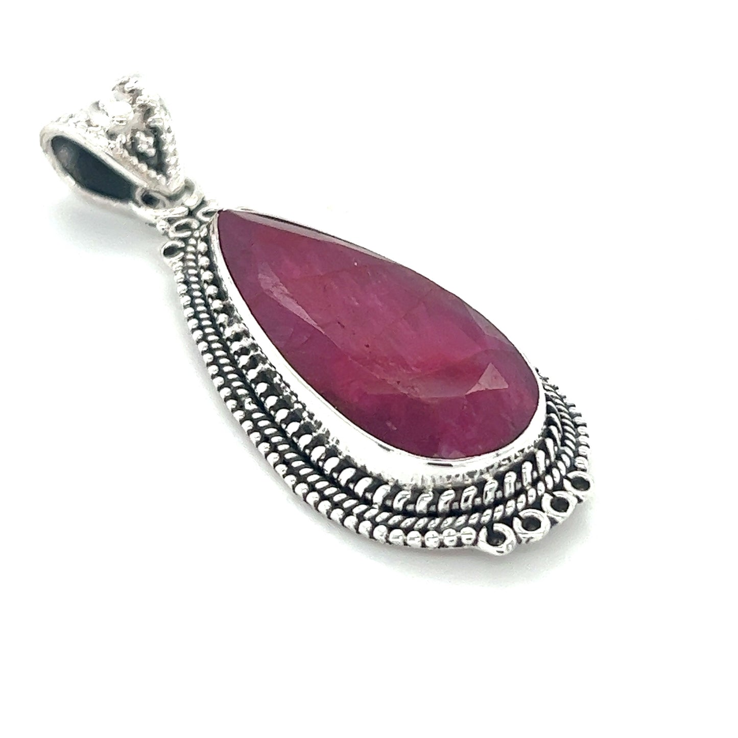 
                  
                    A Striking Teardrop Gemstone Pendant with Beaded Detailing from Super Silver with a ruby stone.
                  
                