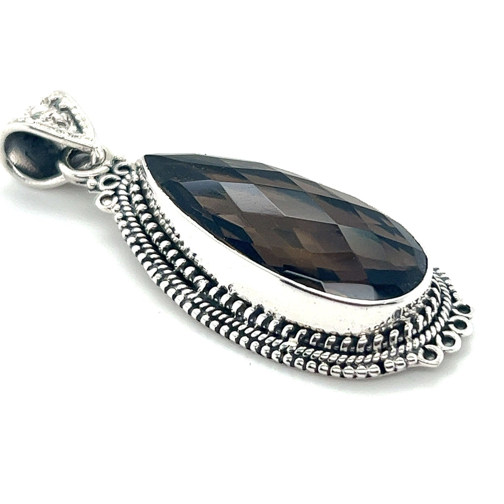 
                  
                    A Super Silver Striking Teardrop Gemstone Pendant with Beaded Detailing, shaped like a teardrop and featuring a smoky quartz stone.
                  
                
