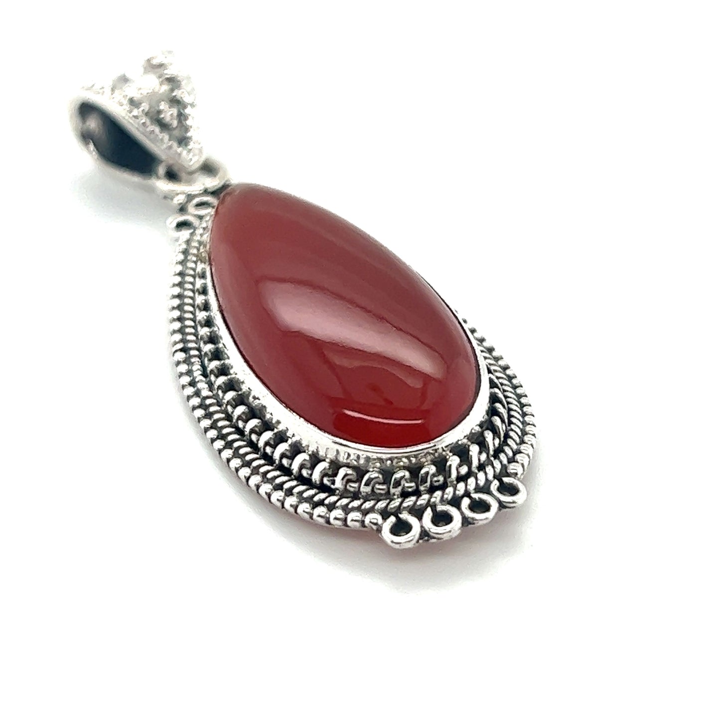 
                  
                    A Super Silver Striking Teardrop Gemstone Pendant with Beaded Detailing featuring a red carnelian stone.
                  
                