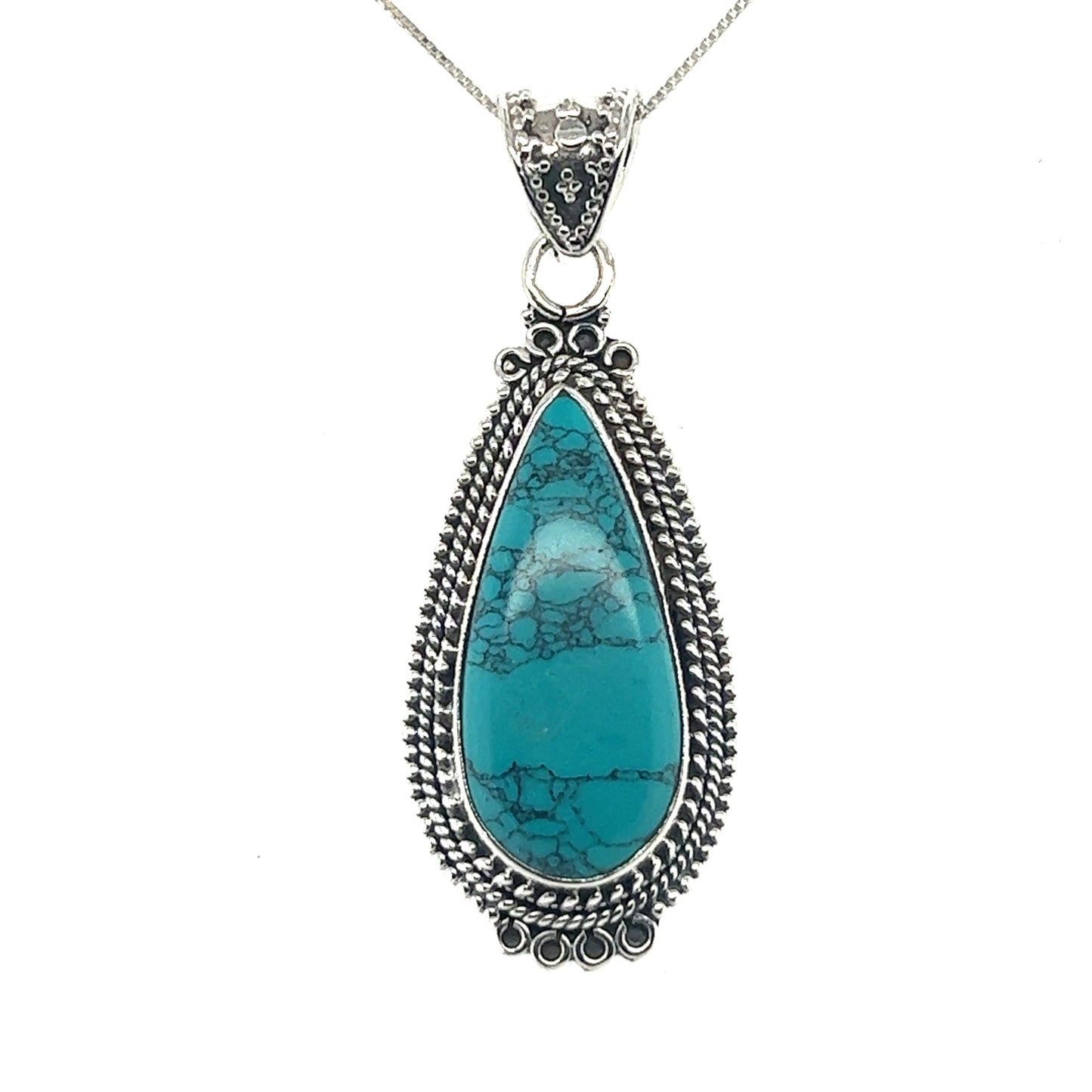 
                  
                    A Super Silver Striking Teardrop Gemstone Pendant with Beaded Detailing featuring a teardrop-shaped turquoise stone.
                  
                