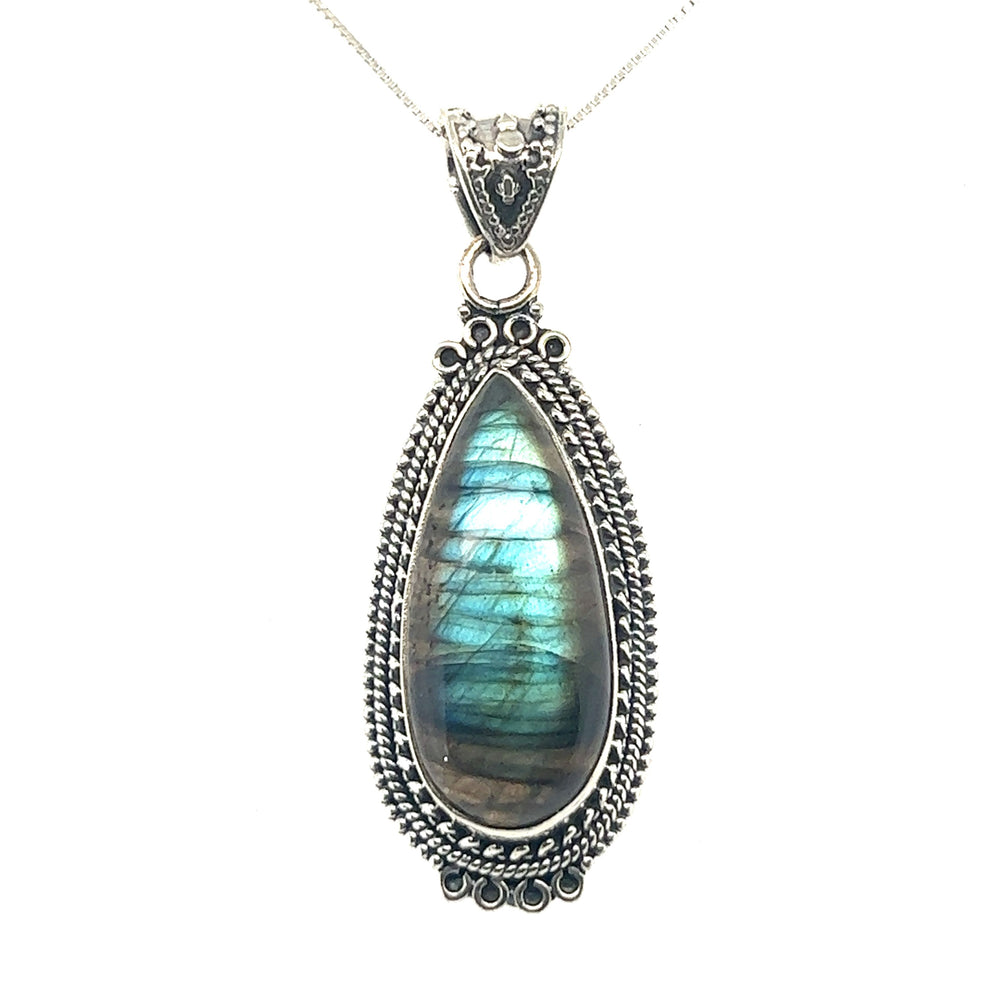 
                  
                    A Super Silver Striking Teardrop Gemstone Pendant with Beaded Detailing paired with a sterling silver chain.
                  
                