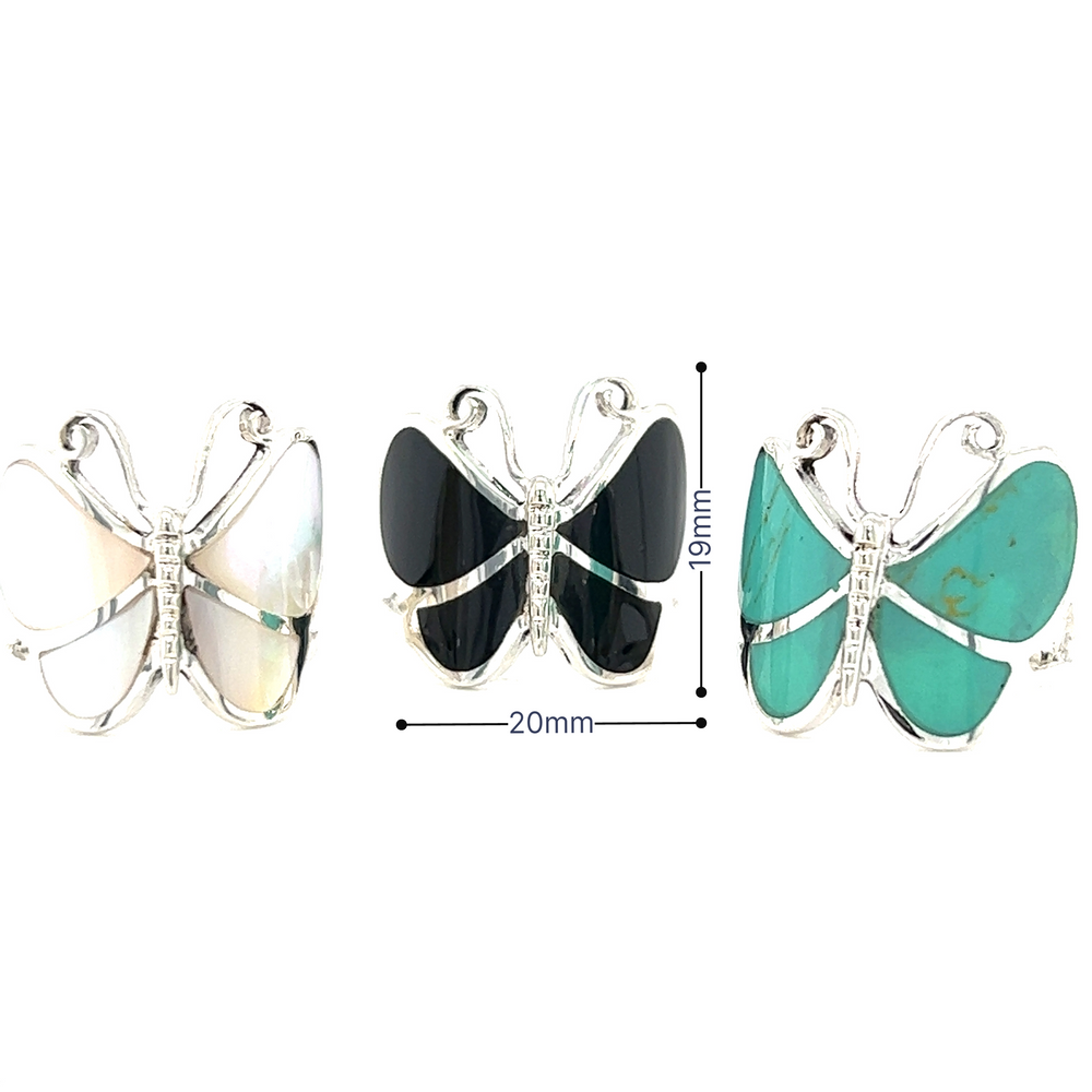 A statement Bold Butterfly Ring with turquoise inlay and black stones.