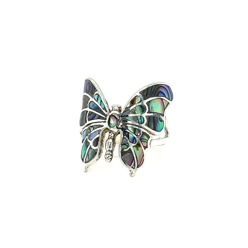 
                  
                    An intricate statement butterfly inlay ring with inlay on a white background.
                  
                