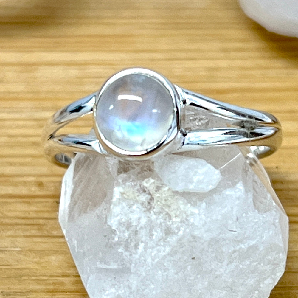 
                  
                    A Circular Minimalist Stone Ring by Super Silver placed delicately atop a rock.
                  
                