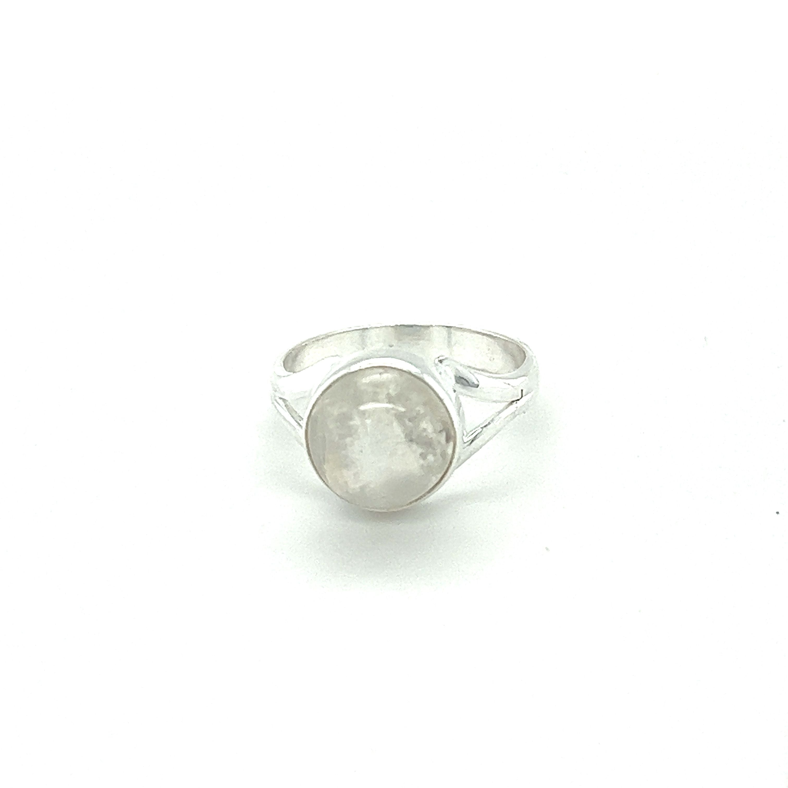 A Simple Vibrant Circular Stone Ring by Super Silver with a natural stone in the middle.
