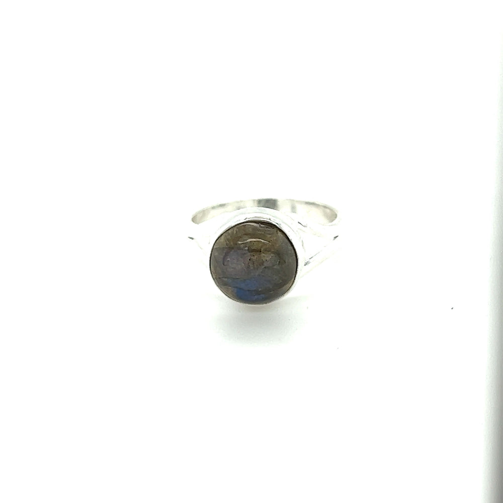 
                  
                    A Simple Vibrant Circular Stone Ring with a vibrant labradorite stone, by Super Silver.
                  
                