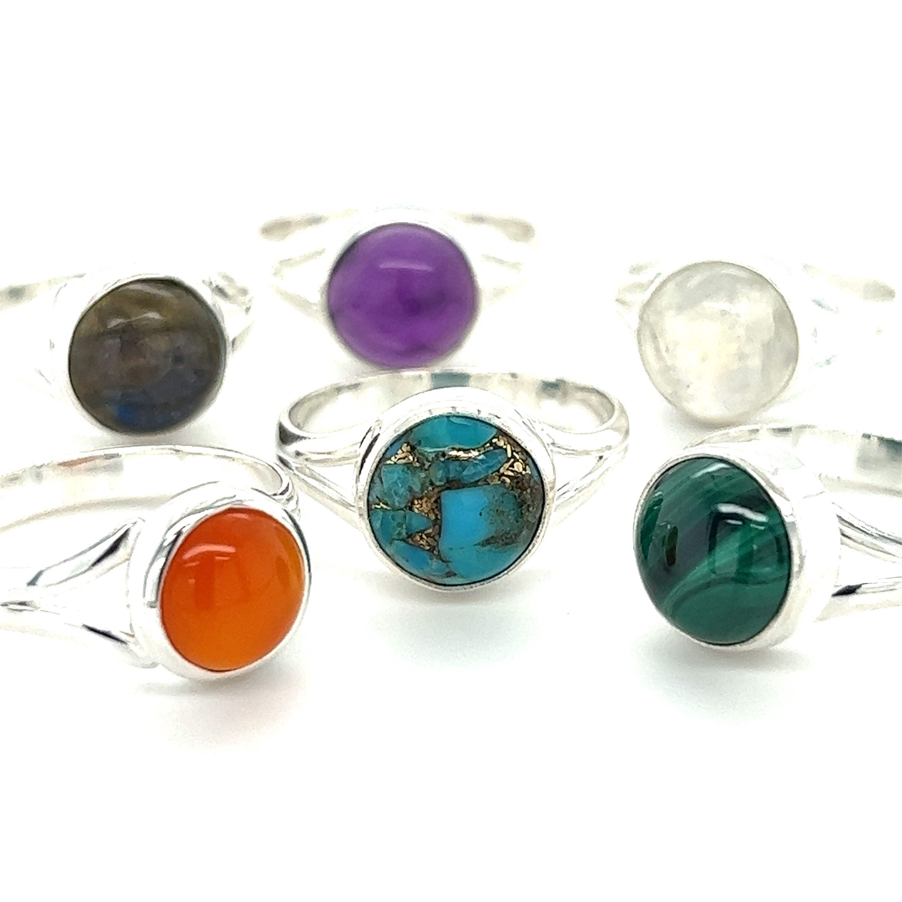 A set of Simple Vibrant Circular Stone Rings by Super Silver, featuring sterling silver bands adorned with natural stones in vibrant colors.