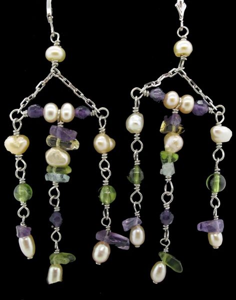 Super Silver's Dangly Multicolor Earrings adorned with green and purple beads.