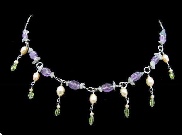 
                  
                    An elegant Sterling Beaded Stone Necklace with multicolored beaded and pearl accents by Super Silver.
                  
                