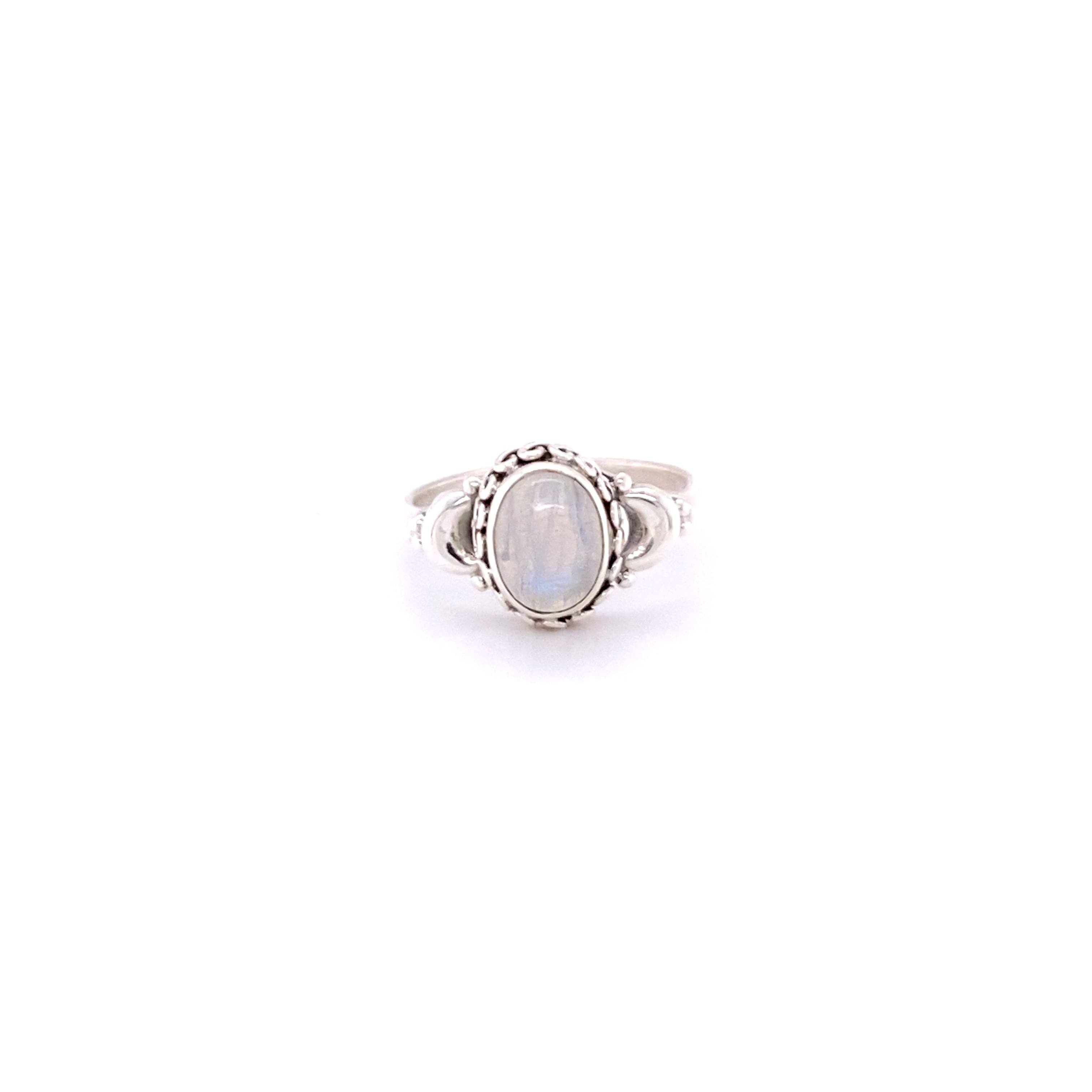 An Beautiful Oval Gemstone Ring with Small Moons on a white background with hippie vibes.