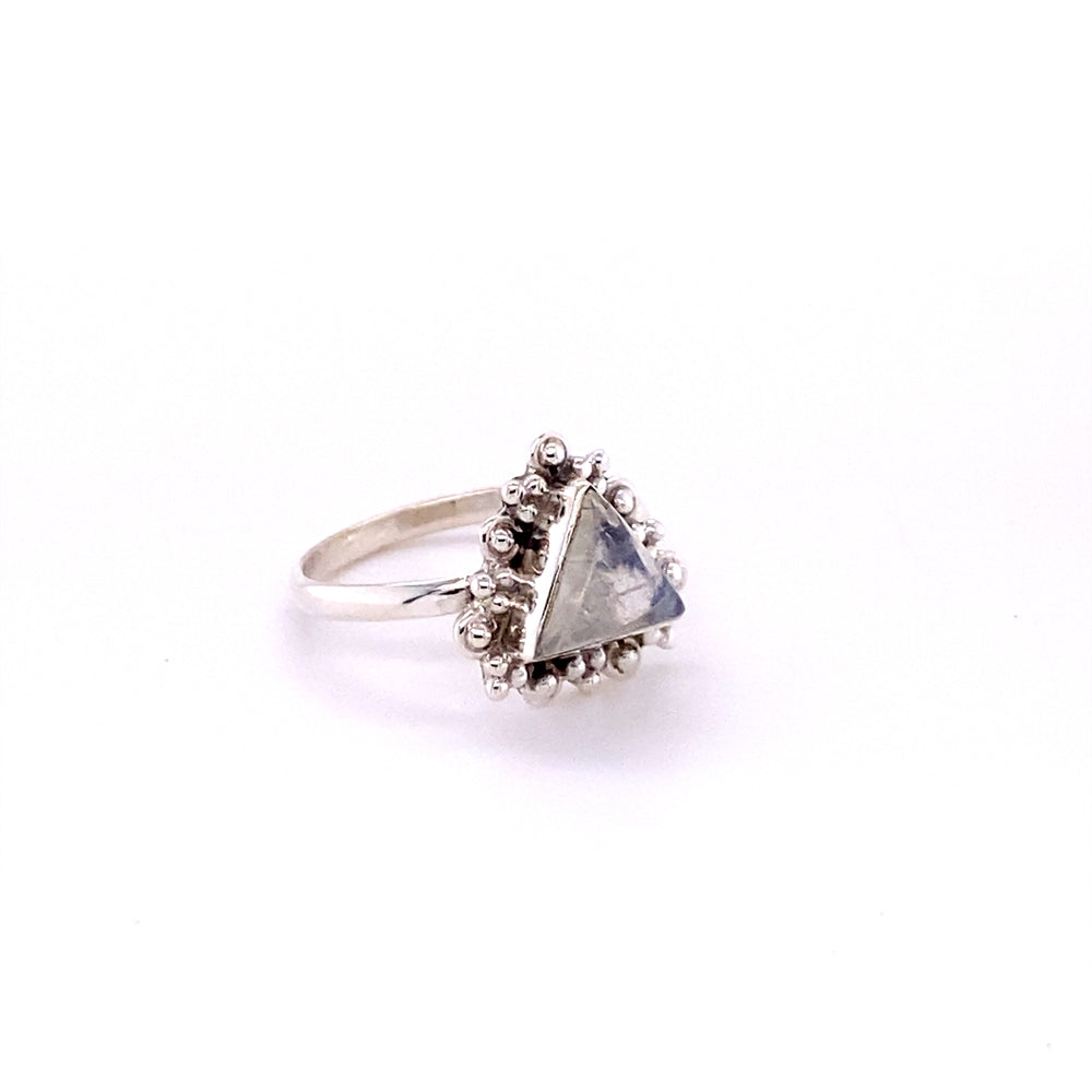 
                  
                    A Super Silver Delicate Gemstone Triangle Ring with a reconstituted turquoise stone.
                  
                