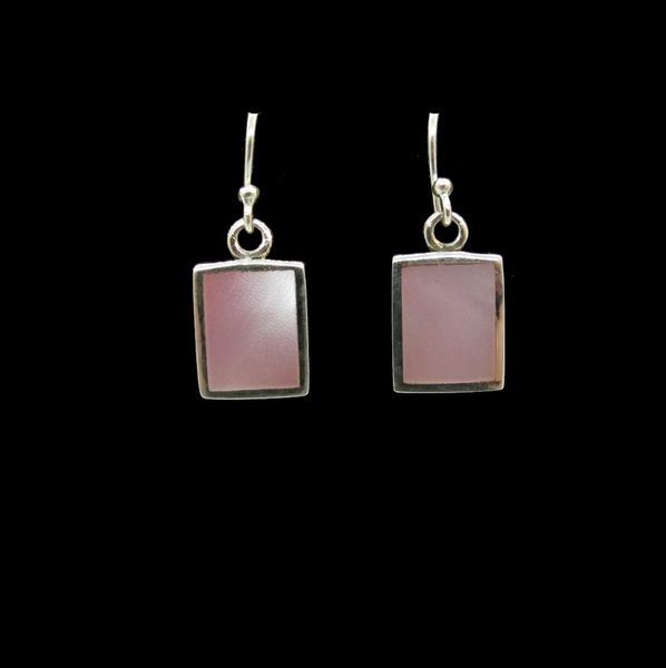 A pair of Super Silver Mother of Pearl Pink Square Dangle Earrings with a touch of mother of pearl on a black background.