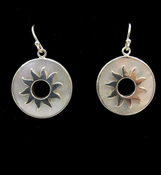 A pair of Super Silver Mother of Pearl Sun Round Earrings, adorned with a sun motif, crafted in silver.