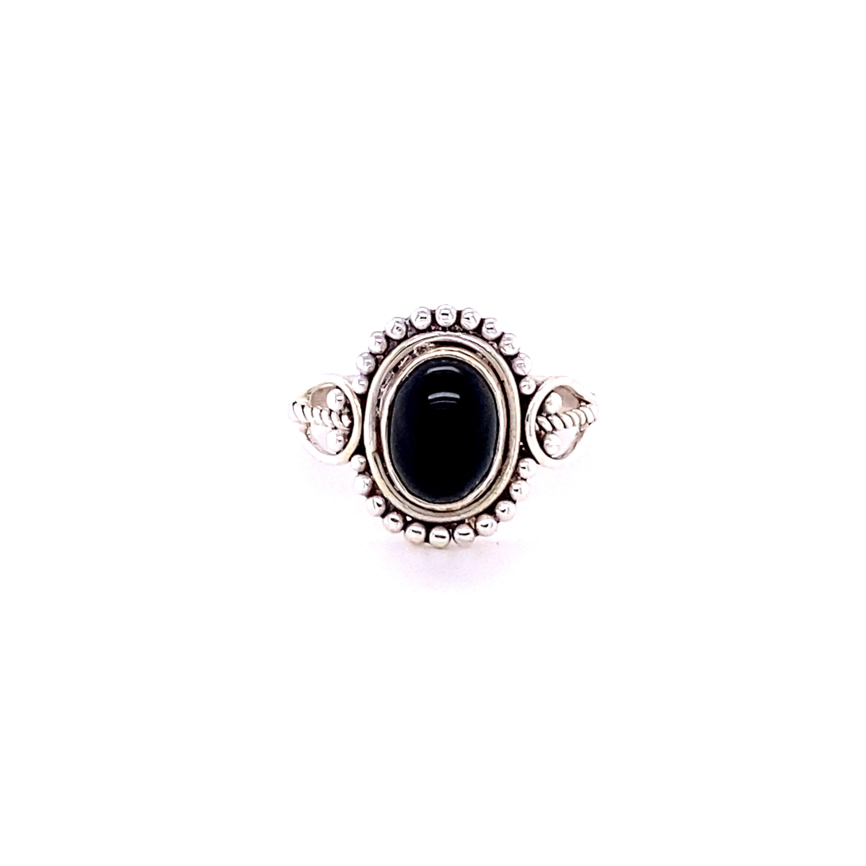 A boho-inspired sterling silver ring adorned with a captivating Oval Gemstone with Ball Design stone.