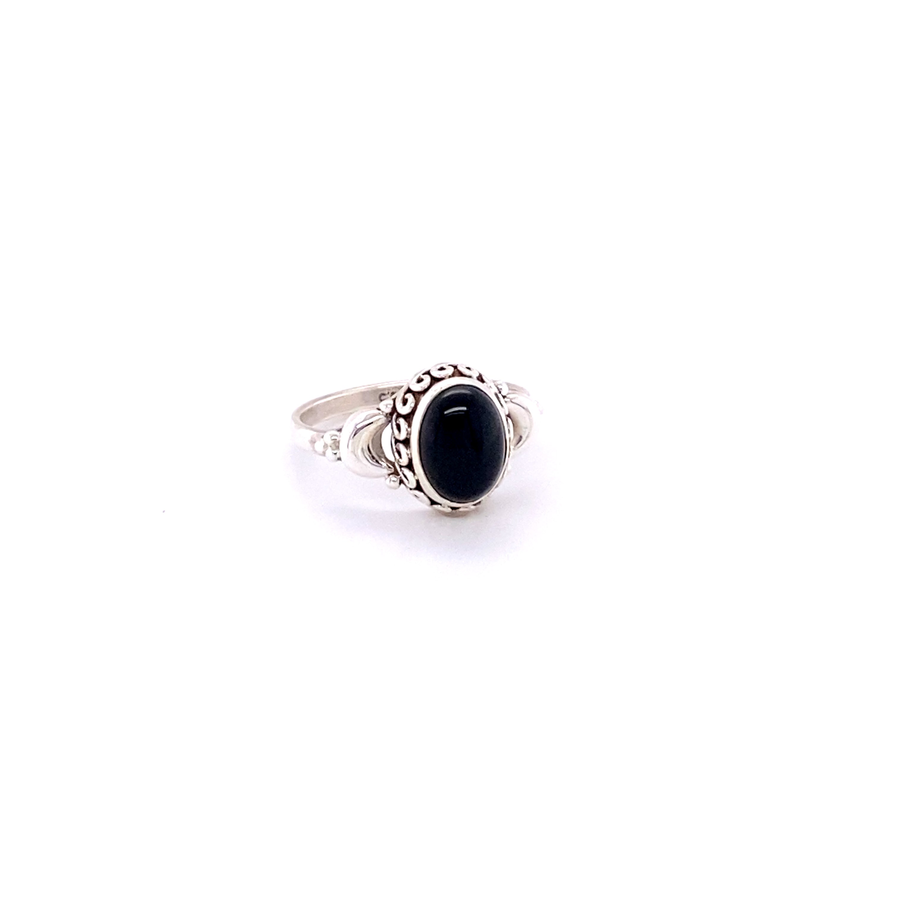 Beautiful Oval Gemstone Ring with Small Moons with a black onyx cabochon.
