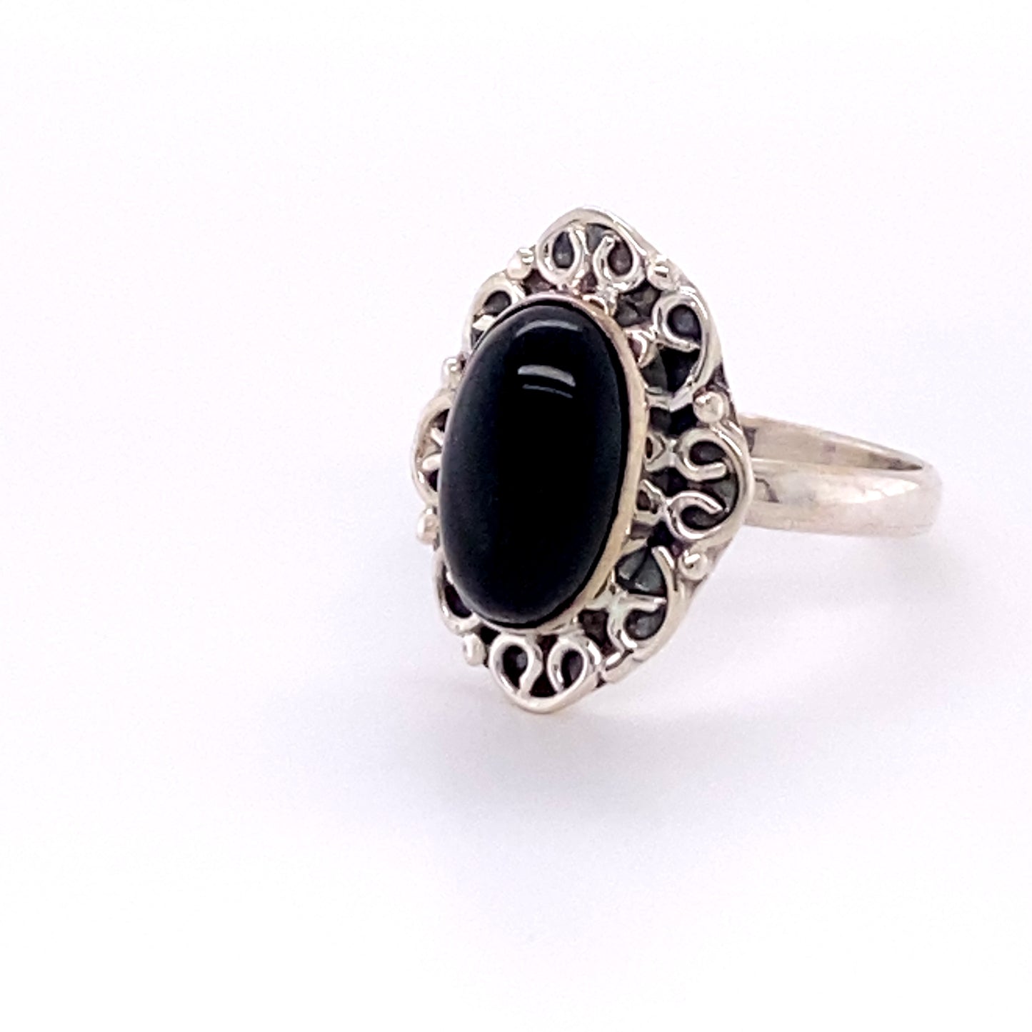 
                  
                    An elegant Super Silver oval gemstone ring with a lacy entwined frills design, showcasing a stunning black onyx gemstone.
                  
                