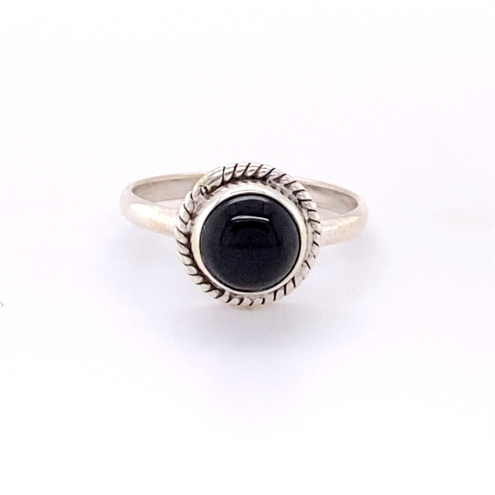 
                  
                    Simple Round Gemstone Ring with Rope Border featuring a black onyx stone.
                  
                