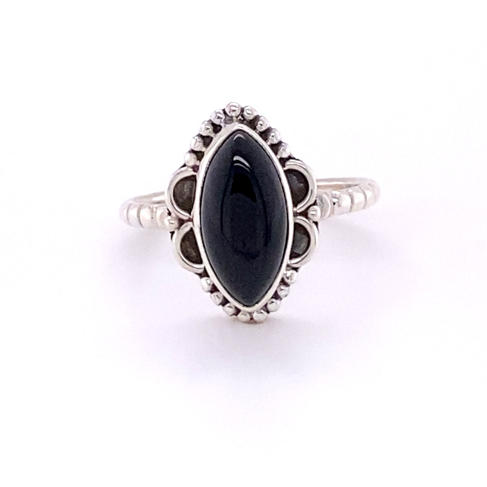 
                  
                    A Marquise Shaped Gemstone Ring with Ball Border and Textured Band with a black onyx stone.
                  
                