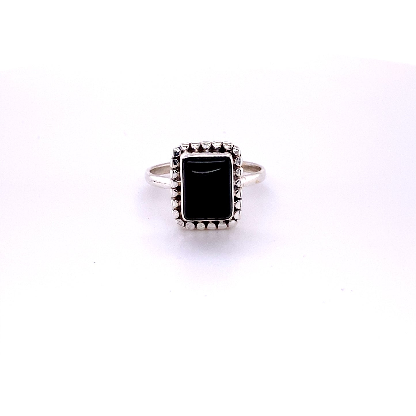 
                  
                    A square ring with natural gemstones on a white background.
                  
                