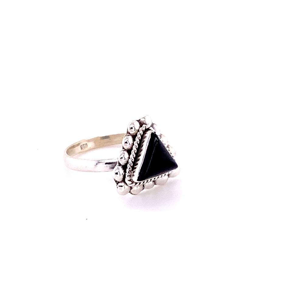 
                  
                    This Super Silver Triangle Gemstone Ring with Beads features a black onyx stone set in a silver bead setting.
                  
                