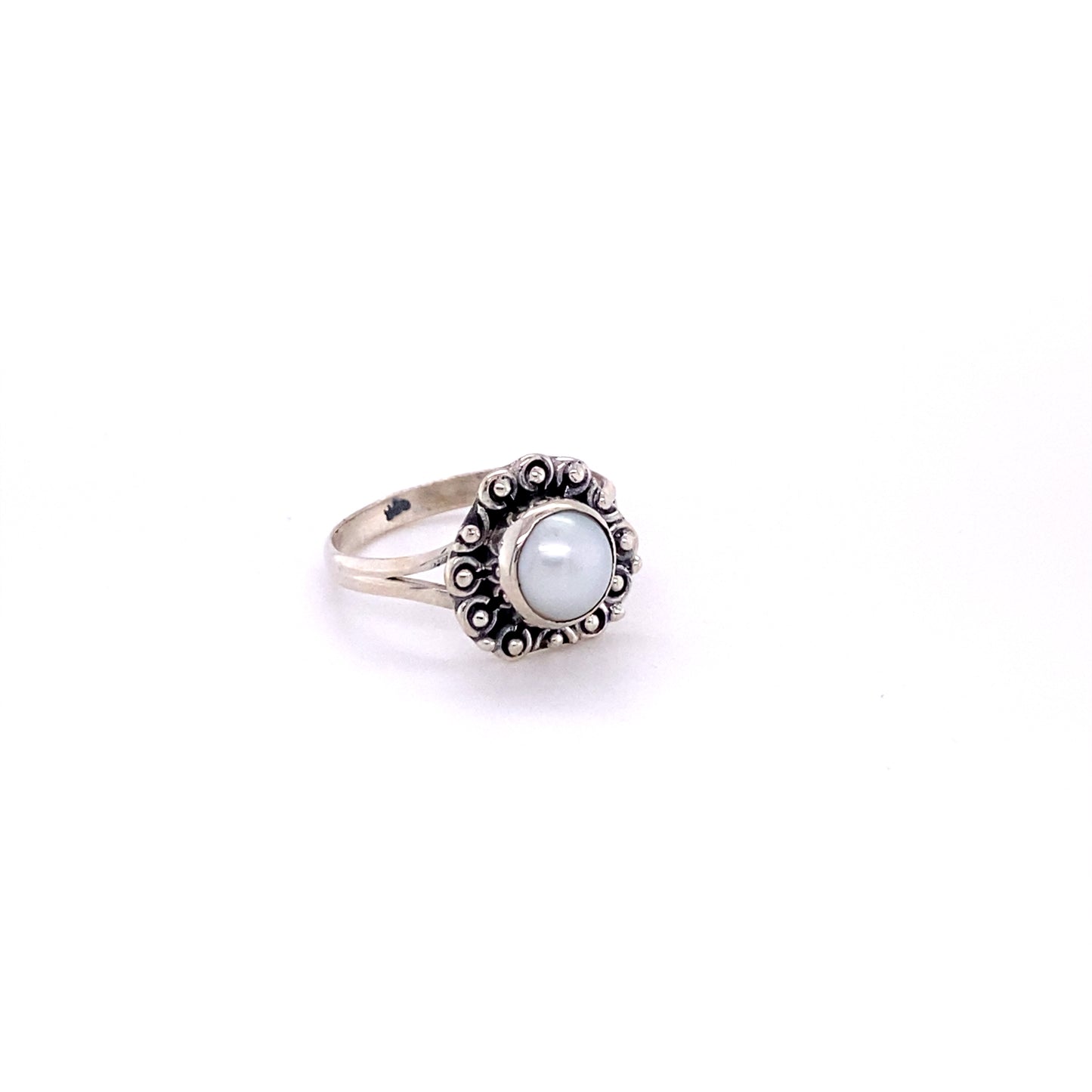 
                  
                    A Triangular Gemstone Ring with A Flat Ball Boarder with a pearl in the center.
                  
                