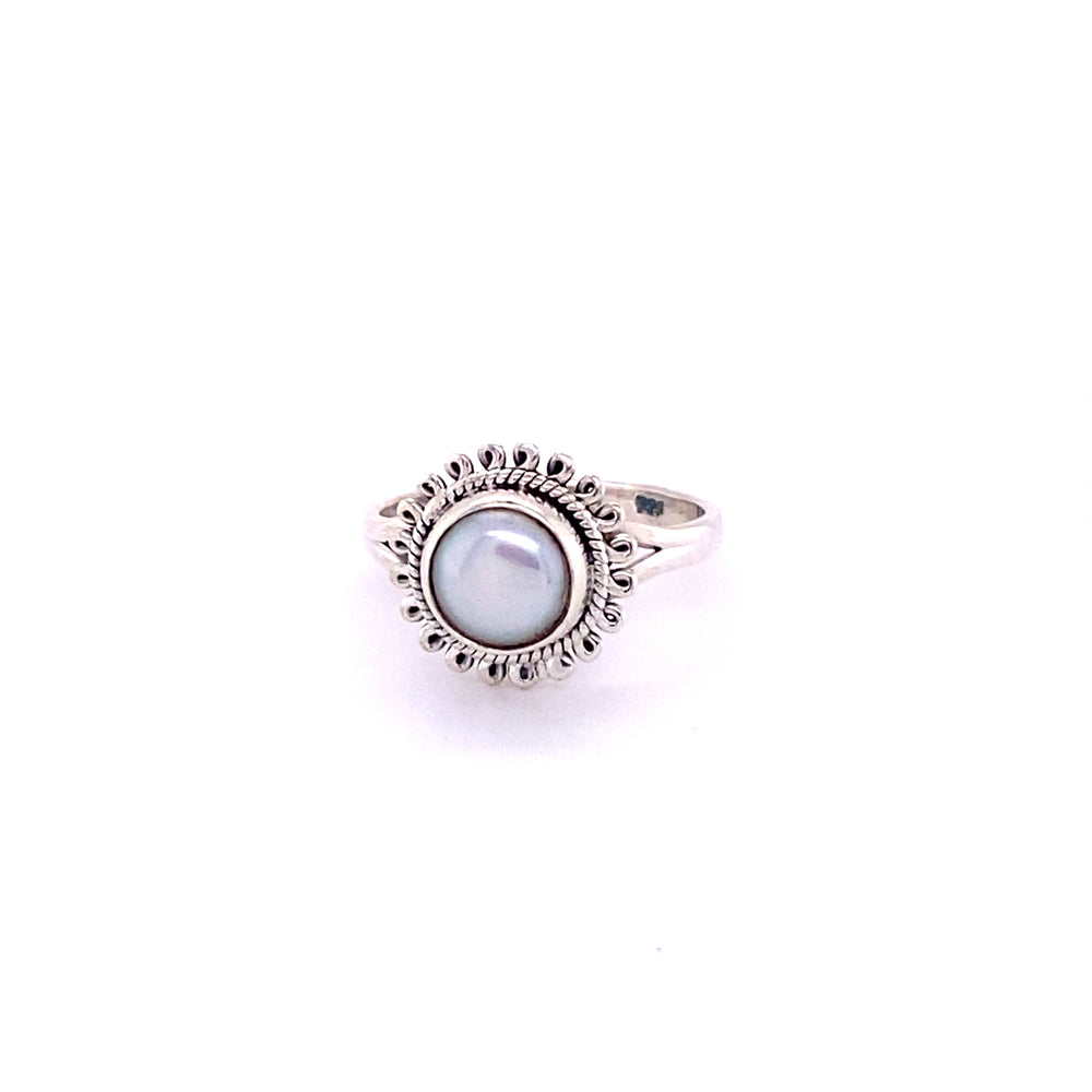 
                  
                    A Hippie-Chic Oval Gemstone Flower Ring adorned with a pearl in the center.
                  
                