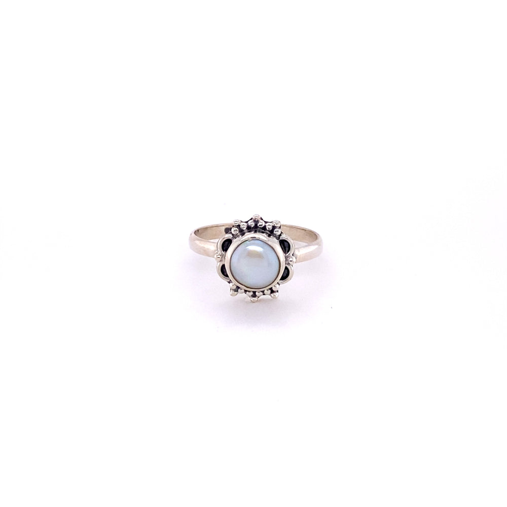 
                  
                    A boho Triangular Gemstone Ring with Frills adorned with a blue stone.
                  
                