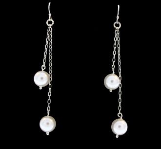 A pair of Super Silver Long Shell Pearl earrings with a rhodium finish.