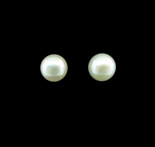 A pair of Super Silver Synthetic Pearl Large Round Studs on a black background.