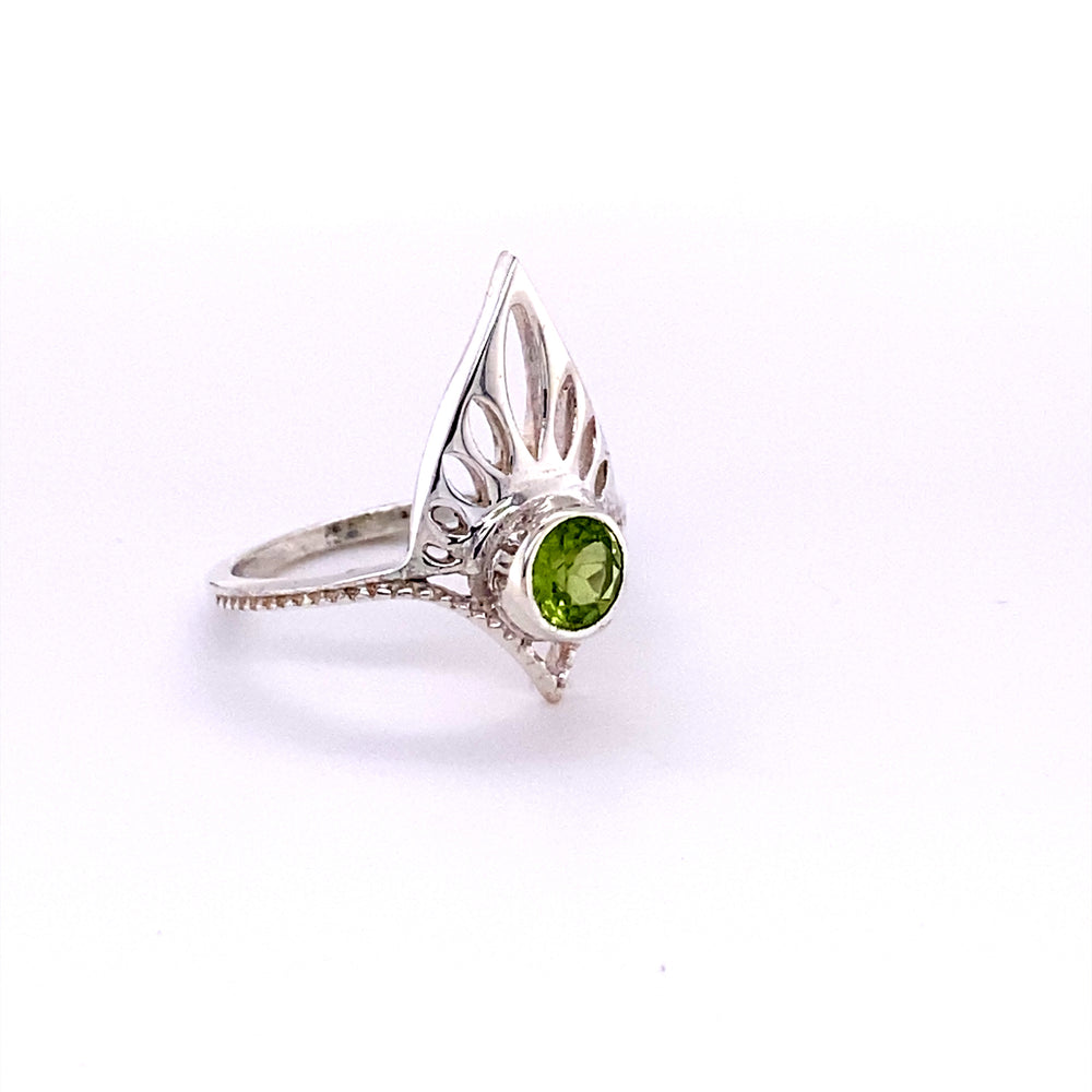 
                  
                    A unique Henna Shield Ring with Natural Gemstones from Super Silver with a peridot stone.
                  
                