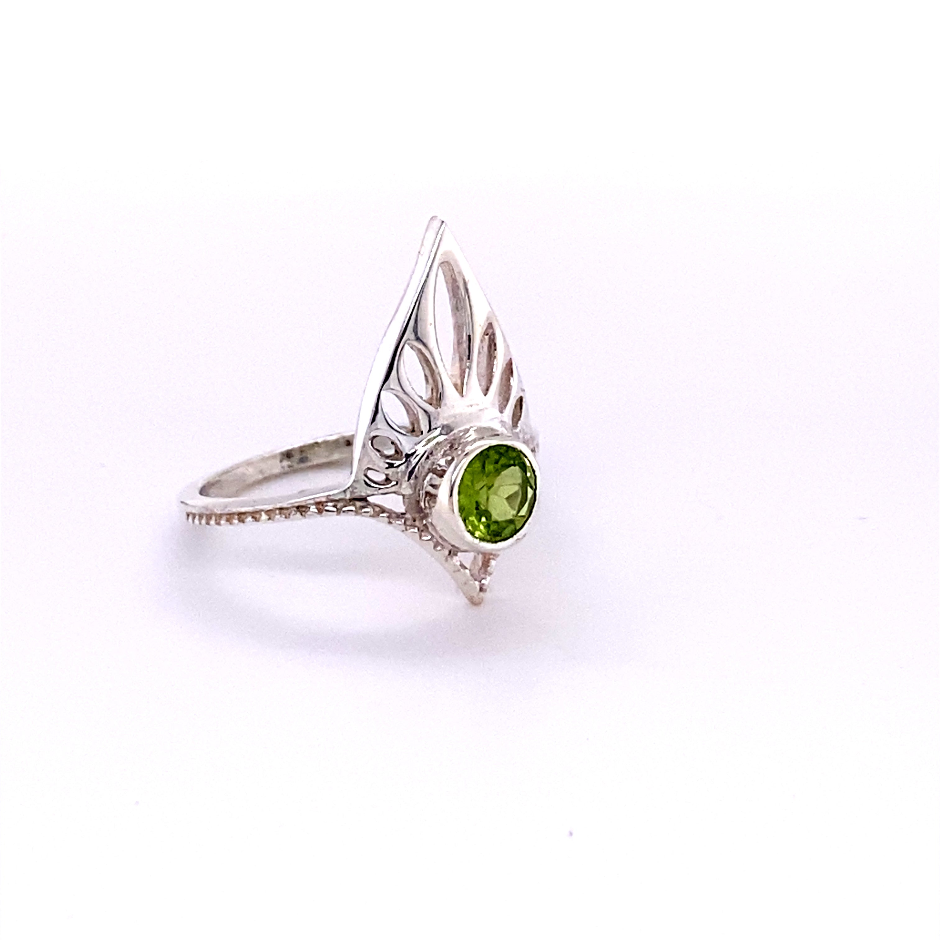 A unique Henna Shield Ring with Natural Gemstones from Super Silver with a peridot stone.