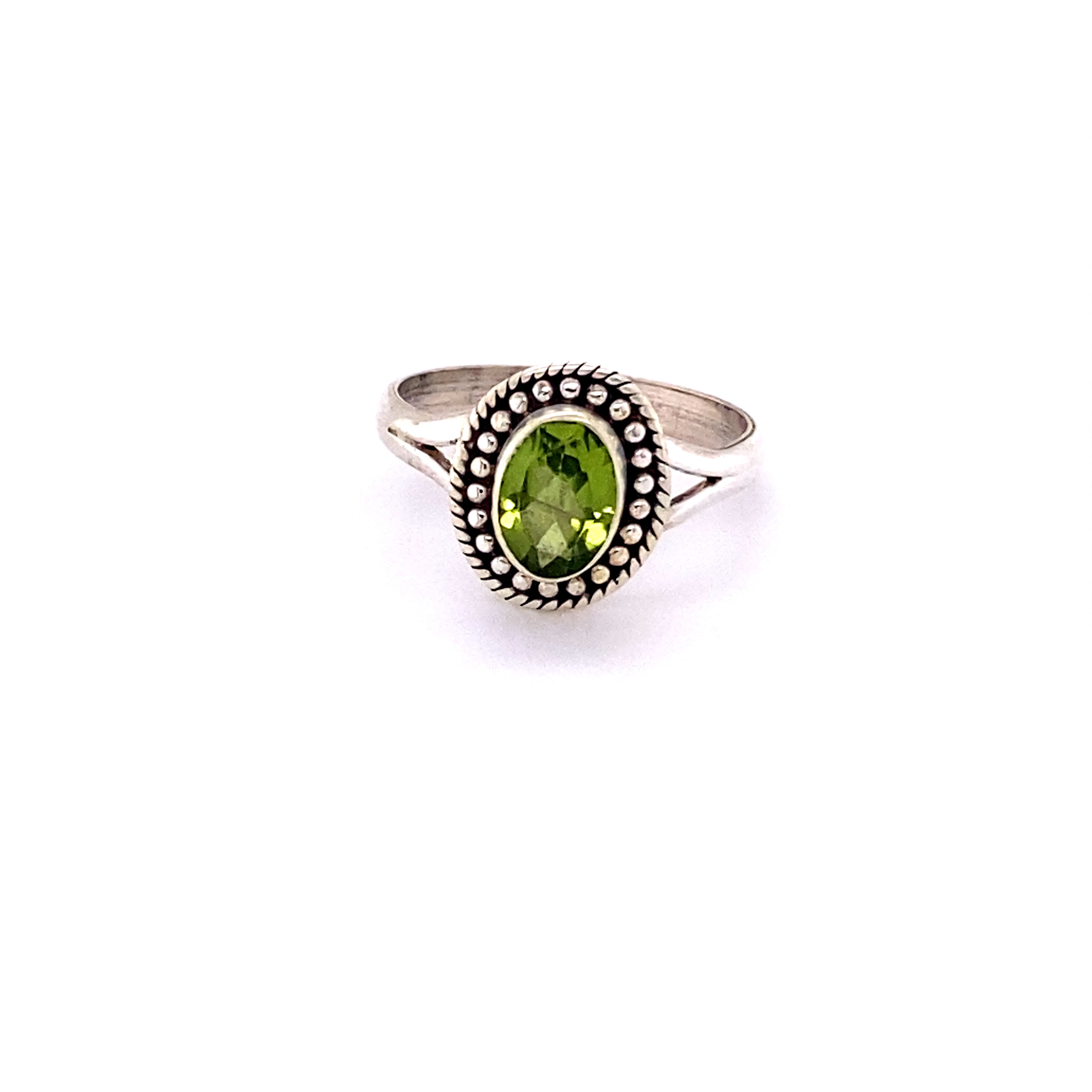 A boho Oval Gemstone Ring with Ball Disk Rope Border on a white background.