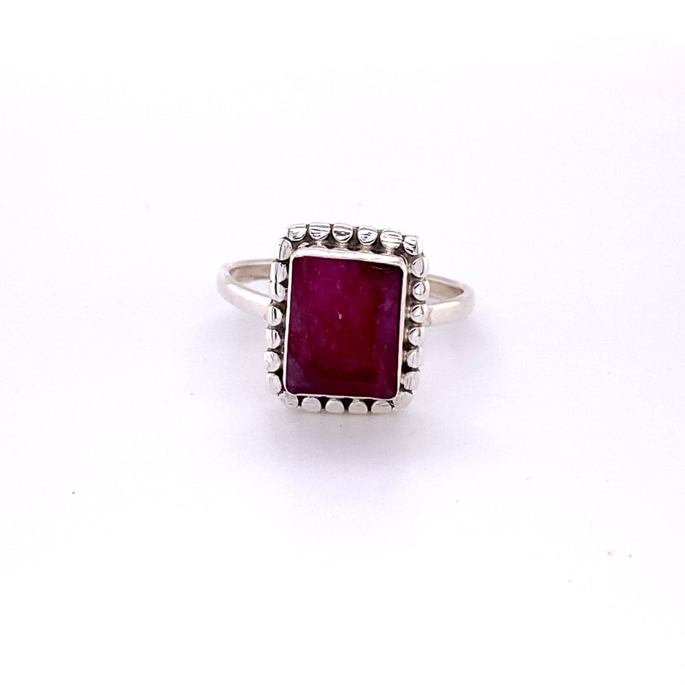 
                  
                    A square ring with natural gemstones in the center.
                  
                