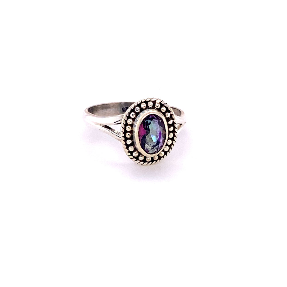 
                  
                    An Oval Gemstone Ring with Ball Disk Rope Border with a black cabochon stone in the center.
                  
                