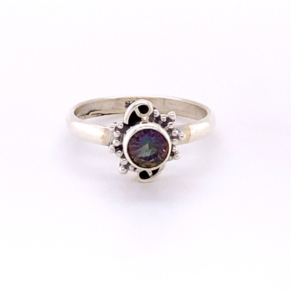 
                  
                    A Small Round Gemstone Ring with Bead and Swirl Border, perfect for the hippie vibe in Santa Cruz.
                  
                