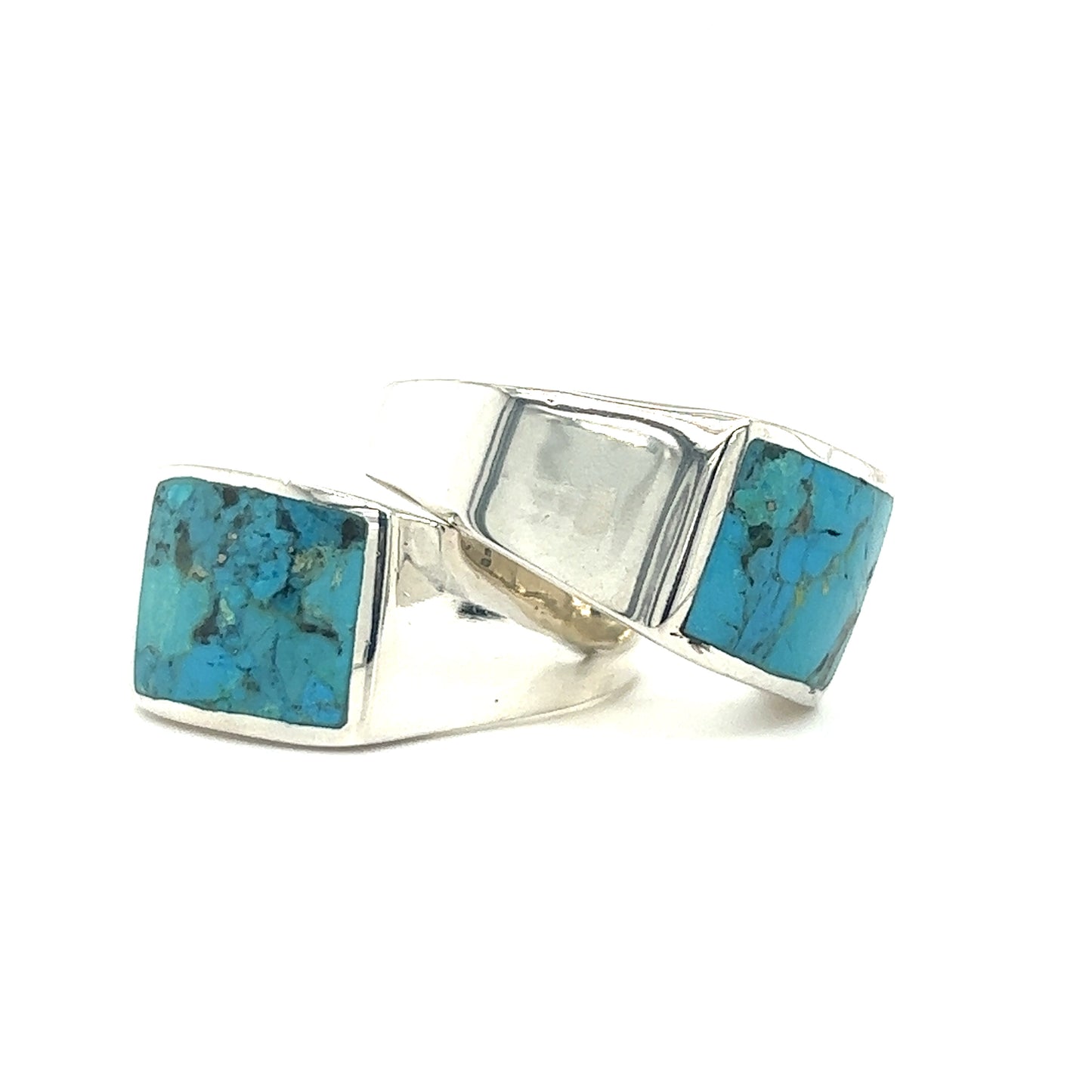 A pair of statement Super Silver Kingman Turquoise signet rings in sterling silver.