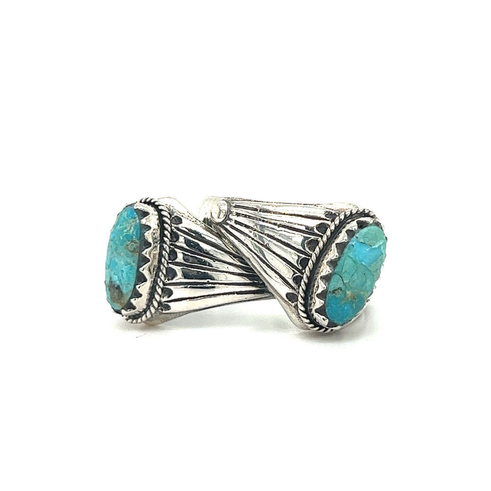 
                  
                    A pair of minimalist silver rings with Southwest Inspired Kingman Turquoise stones.
                  
                