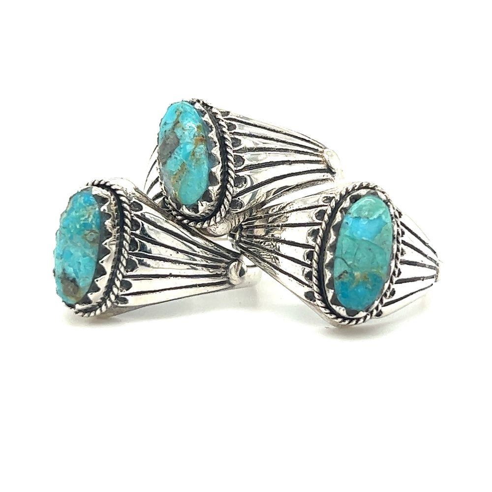 
                  
                    A pair of Southwest Inspired Kingman Turquoise Rings with turquoise stones.
                  
                