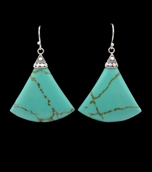 A pair of Super Silver Turquoise Triangle Dangle Earrings with diamonds on them, featuring a triangle shape for added uniqueness.