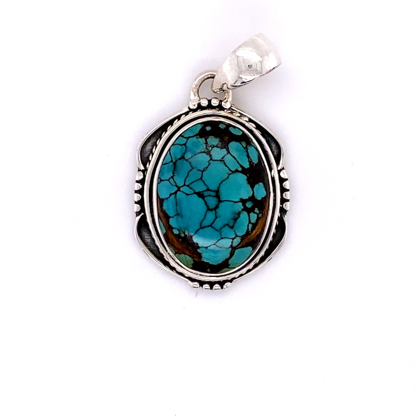 
                  
                    Super Silver's Natural Turquoise Pendant with an Oval Shield Setting on a white background.
                  
                