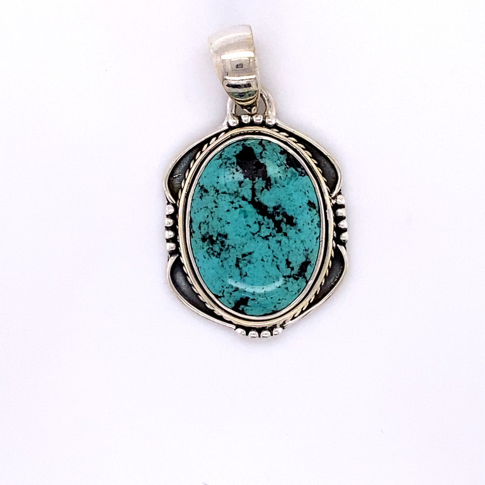 
                  
                    Natural Turquoise Pendant with an Oval Shield Setting
                  
                