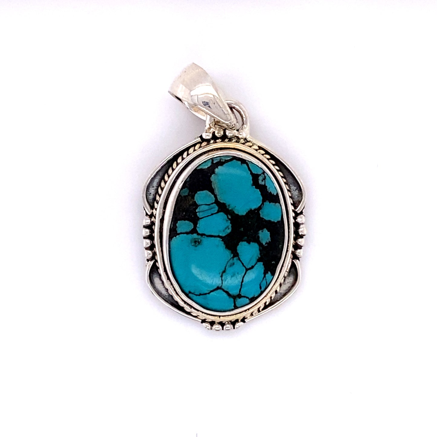 
                  
                    A Super Silver handmade sterling silver pendant with a Natural Turquoise Pendant with an Oval Shield Setting.
                  
                